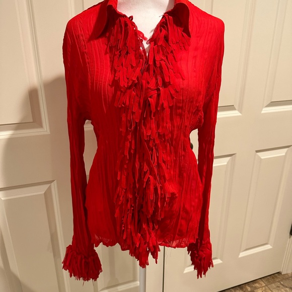 Adorable red long sleeved button up blouse with fringe on front and cuffs. - Picture 2 of 4